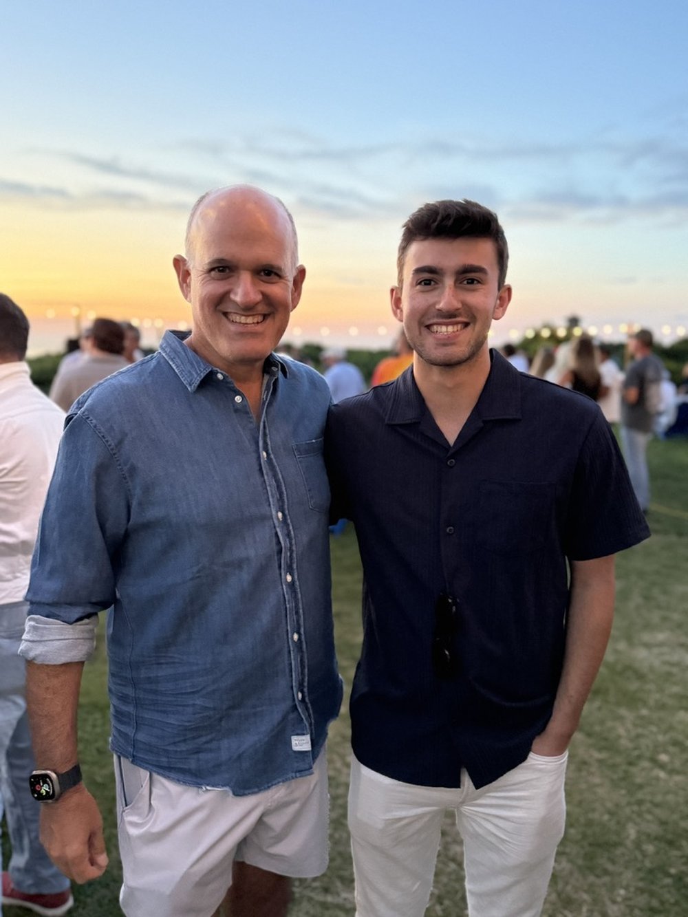 Rob and Zachary, the founders of LivingLean, standing together at sunset